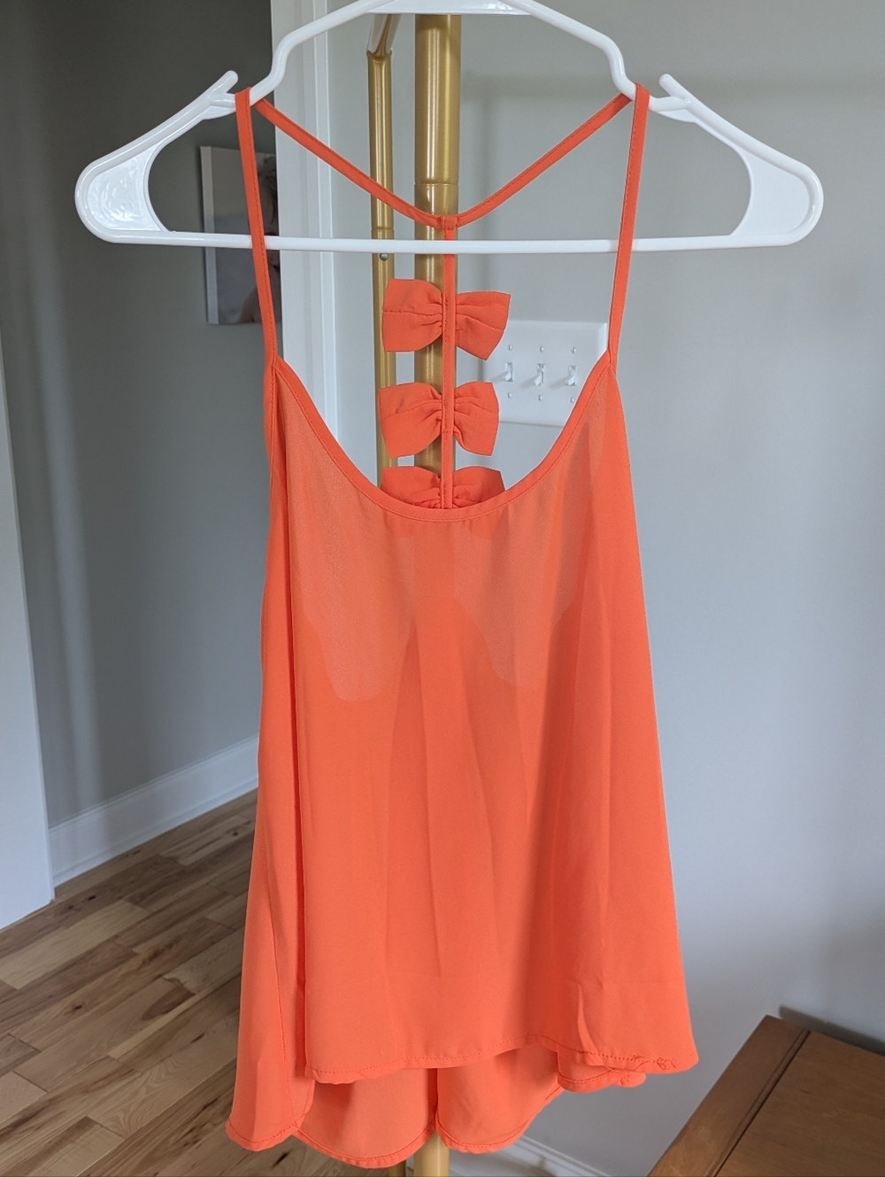 Give Her Six Sleeveless Orange Bow-Back Tank Top
